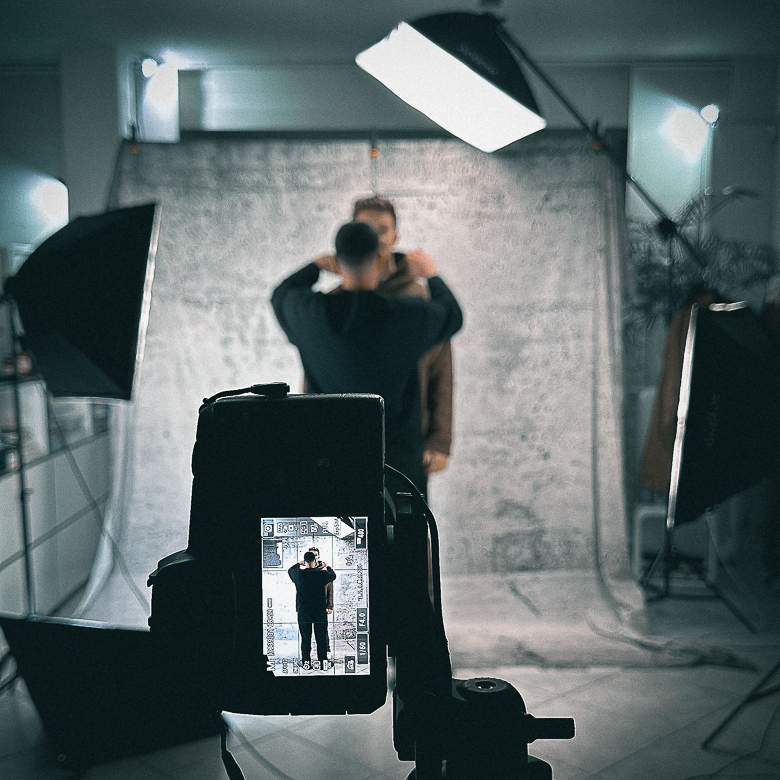Behind the scene photo of the camera-screen and set during a fashion-brand photoshooting